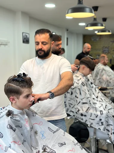 Patient cut for a young customer at Fade & Trim Barbers