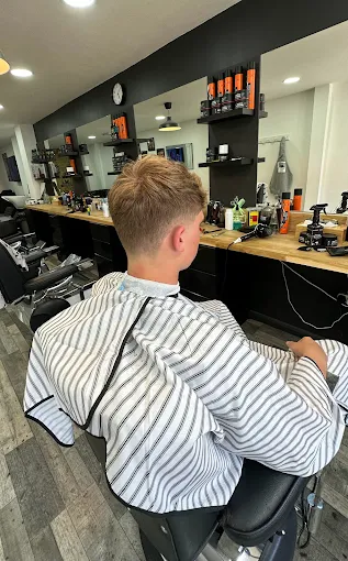 Customer with a fresh cut at Fade & Trim Barbers